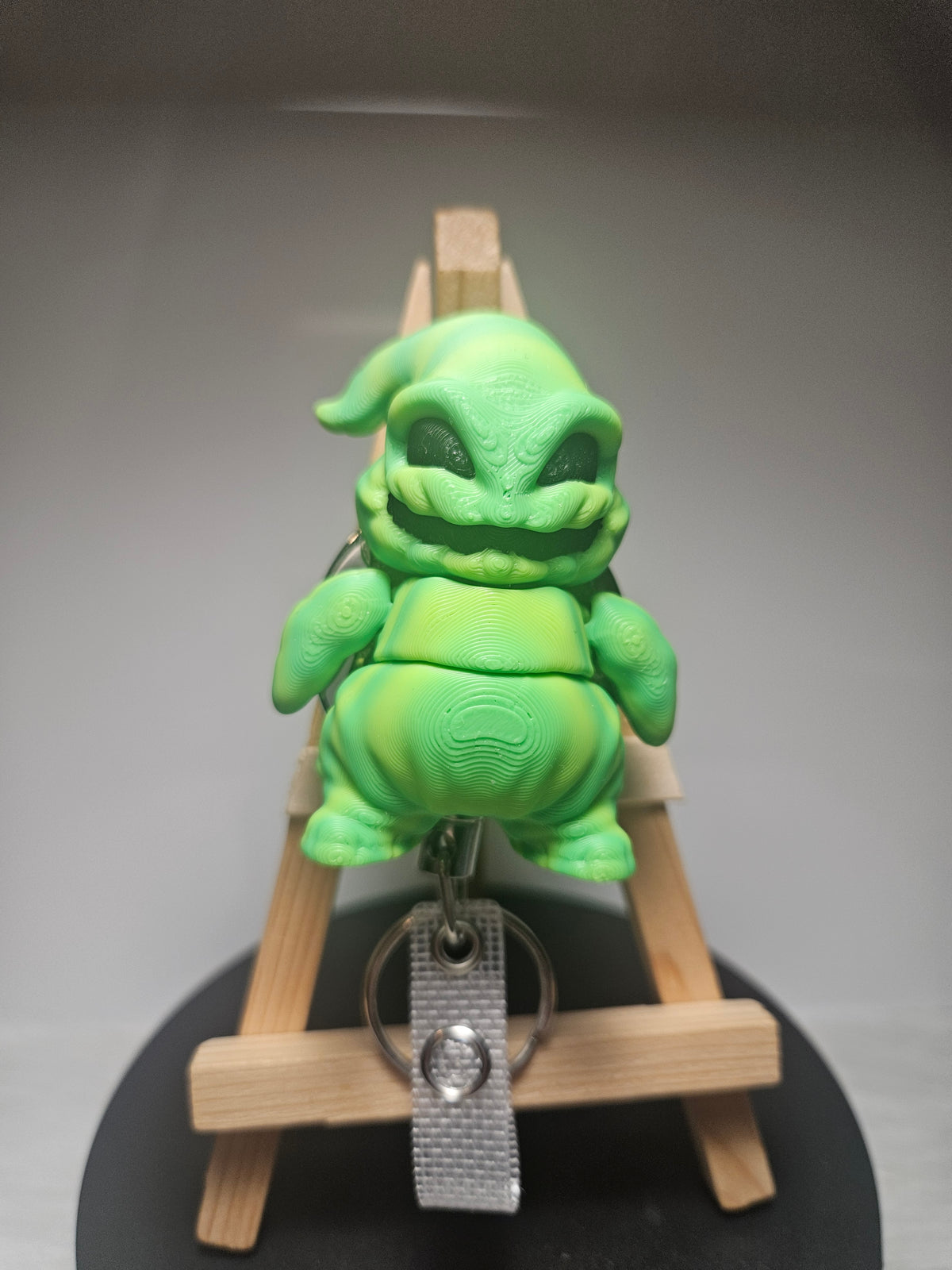 Oogie Boogie 3D clip badge, lime-green figure with metal keyring clip strap