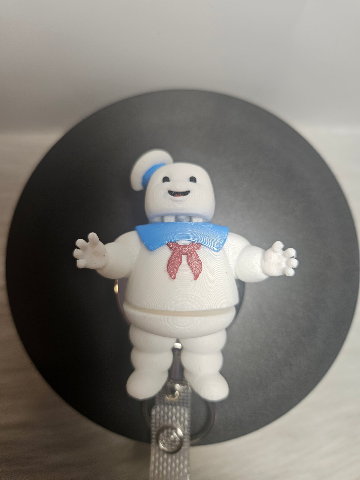 3D printed Stay Puft marshmallow man belt clip figure, blue bow tie and red details