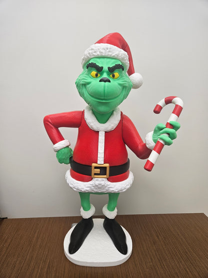3D-printed Grinch figure in red Santa outfit with hat, holding candy cane