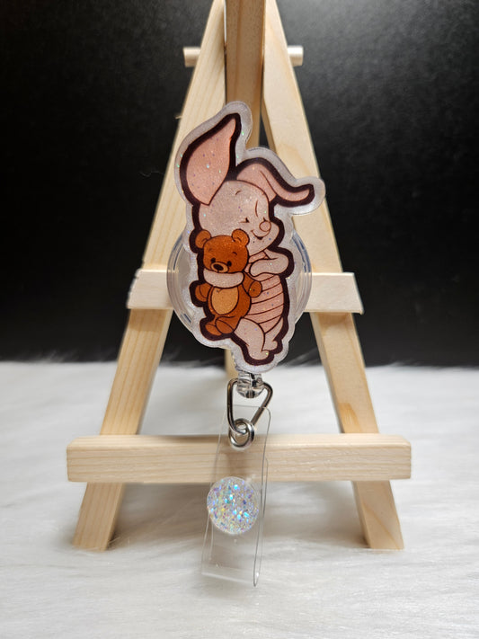Piglet badge reel with cartoon pig and teddy, clear round bead charm and metal clip